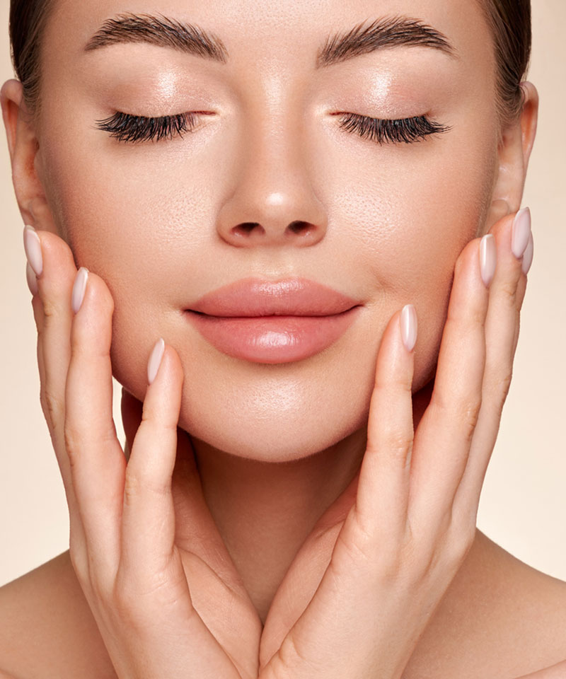 Woman touching face. Dr. Costa non surgical procedures Las Vegas